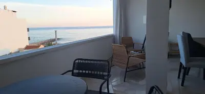 a view of a city from a window with two chairs at Casa Cardoso in Quarteira