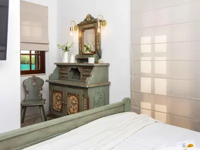 a bedroom with a mirror and a bed at Algarve Sun by Stay ici - Algarve Holiday Rental in Albufeira