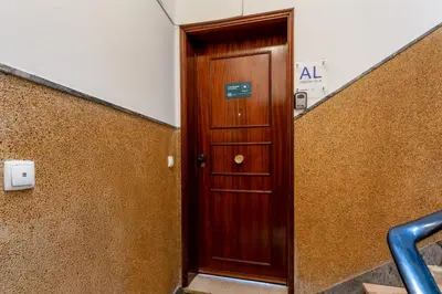 a wooden door in a hallway in a building at Cosy 2Bdr Flat in Faro Downtown by LovelyStay in Faro