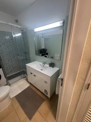 a bathroom with a sink and a shower and a toilet at Relaxing studio in Albufeira Jardim in Albufeira