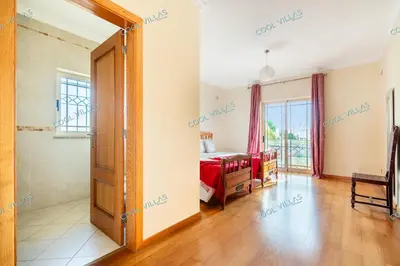 a bedroom with a bed and a window at Villa Cibel - Beach & Golf 10pax in Guia