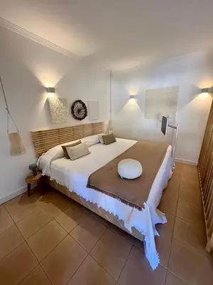 a bedroom with a large white bed in a room at Salgados Studio in Guia
