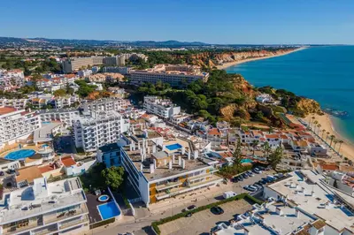 an aerial view of a city and the beach at Bright 2BR with Pool near Beach by LovelyStay in Albufeira