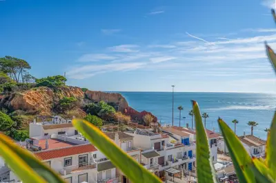 a view of the ocean from a city at Bright 2BR with Pool near Beach by LovelyStay in Albufeira
