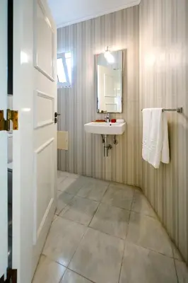 a bathroom with a sink and a mirror at Sunrise Beach Villa by Delilah Collection in Albufeira