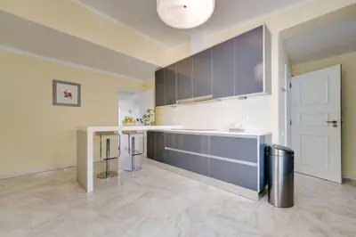 a large kitchen with a sink and a counter at Sunrise Beach Villa by Delilah Collection in Albufeira