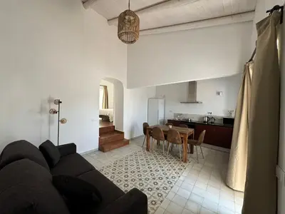 a living room with a couch and a table at Quinta Do Olival - Casa Figueira - Calm & wellness in São Brás de Alportel