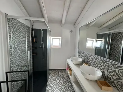 a bathroom with two sinks and a shower at Quinta Do Olival - Casa Figueira - Calm & wellness in São Brás de Alportel