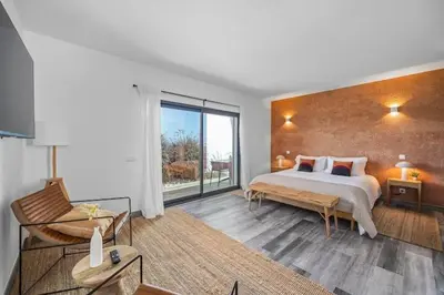 a bedroom with a large bed and a large window at Amazing Views Villa in Loulé