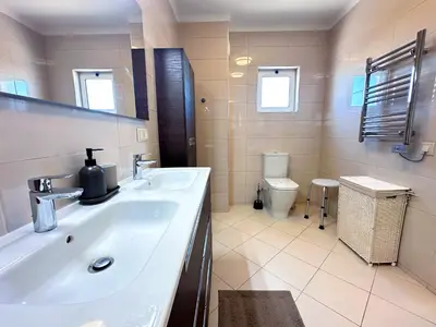 a bathroom with a sink and a toilet at WindMill Rooftop Panoramic OceanView Condo By BeCherish in Albufeira