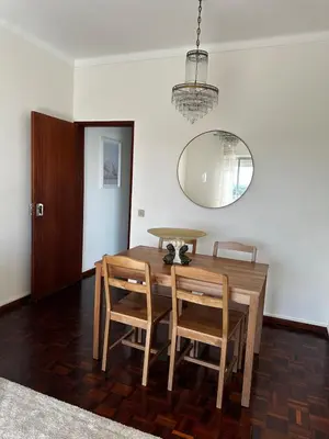 a bedroom with a green bed and a mirror at Old town and Rias view in Faro