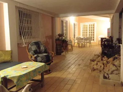 a living room with a table and chairs at Casa Olivier in Loulé
