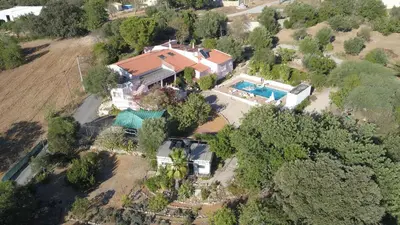 an aerial view of a house with a swimming pool at Casa Olivier in Loulé