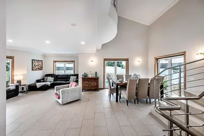 a living room with a table and a couch at Villa Gale Coast in Guia