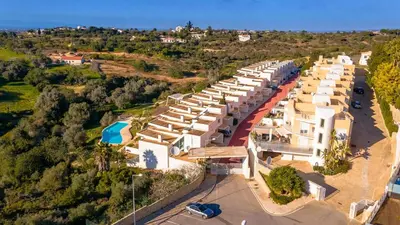 an aerial view of a resort with a parking lot at Terras Novas Albufeira in Albufeira
