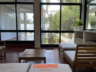 a room with tables and chairs and large windows at Casa di Campara Almada Villa in FAO
