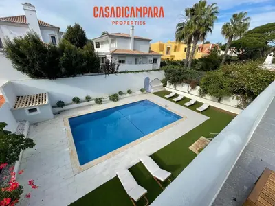 a swimming pool in the backyard of a house at Casa di Campara Almada Villa in FAO