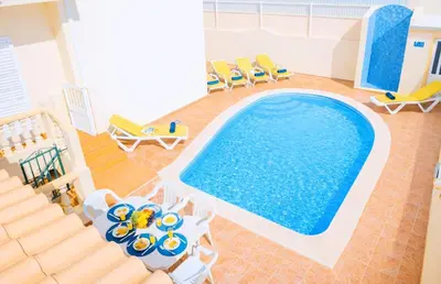 a bedroom with a bed and a large window at Villa Atlantis by Algarve Vacation in Guia