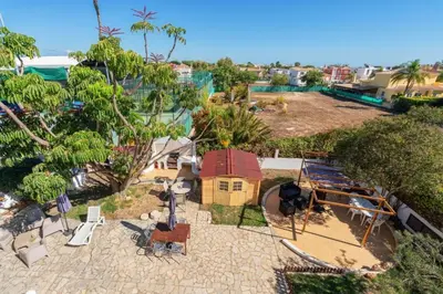 an aerial view of a backyard with a house at Blife Sunya private rooms near airport and nature in Faro