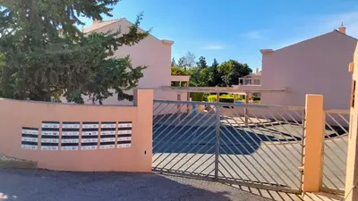 a gate in front of a house at Casa Balaia in Olhos de Água