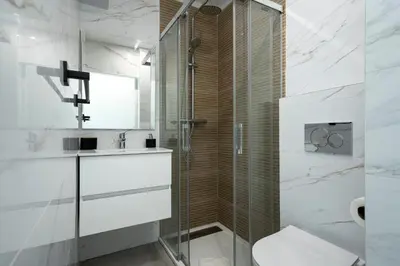 a bathroom with a shower and a sink and a toilet at Casa Pereira - Guest House Faro City Center in Faro