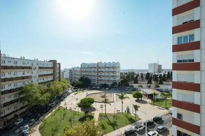 a view of a city with buildings and a park at Casa Pereira - Guest House Faro City Center in Faro