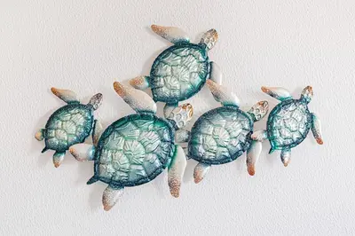 a group of green turtles on a wall at Le Bleu de la Mer in Albufeira