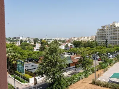 a view of a city from a building at Vilamoura Sea View Apartment by Stay ici Algarve Holiday Rental in Quarteira