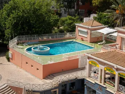 an overhead view of a swimming pool on top of a building at Vilamoura Sea View Apartment by Stay ici Algarve Holiday Rental in Quarteira