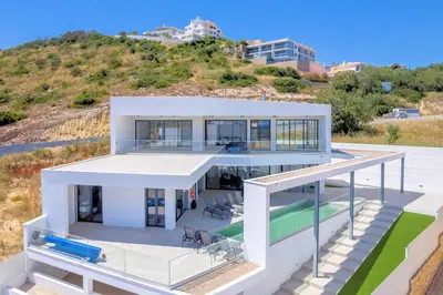 an aerial view of a house with a swimming pool at Villa Vista Albufeira Sea Views Heated Pool Walk To Marina in Albufeira
