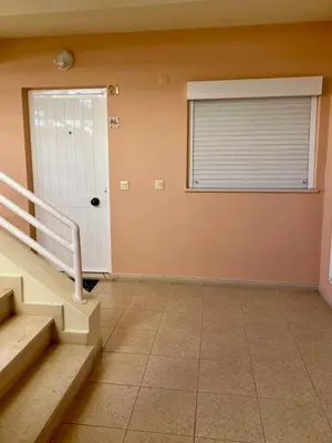 a room with stairs and a door with a window at Vilamoura View Apartment in Quarteira