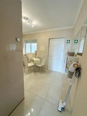 a kitchen and dining room with a table and chairs at Vilamoura View Apartment in Quarteira