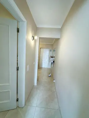a room with a hallway with a camera on a tripod at Vilamoura View Apartment in Quarteira
