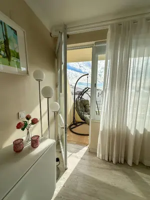 a living room with a sliding glass door to a balcony at Vilamoura View Apartment in Quarteira
