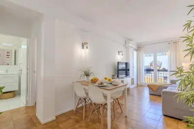 a kitchen and living room with a table and chairs at #347 Albufeira Dream Home by Home Holidays in Albufeira