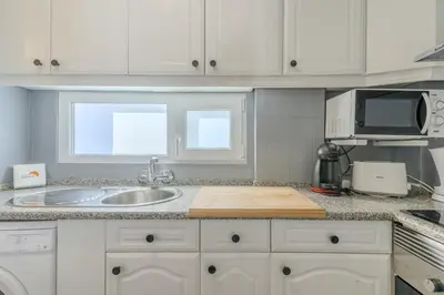 a kitchen with a sink and a microwave at #347 Albufeira Dream Home by Home Holidays in Albufeira