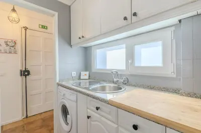 a kitchen with a sink and a washing machine at #347 Albufeira Dream Home by Home Holidays in Albufeira