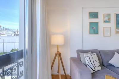 a living room with a couch and a window at #347 Albufeira Dream Home by Home Holidays in Albufeira