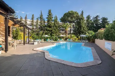 a swimming pool in the middle of a courtyard at Studio 54 by Sunnyway in Albufeira