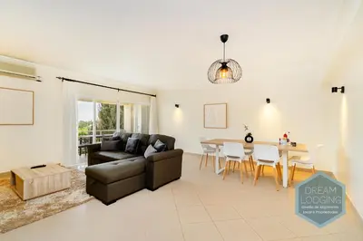 a living room with a couch and a table at Albufeira Breeze Living - Dream Lodging in Albufeira