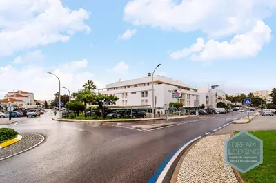 a street with a sign on the side of a road at Albufeira Breeze Living - Dream Lodging in Albufeira
