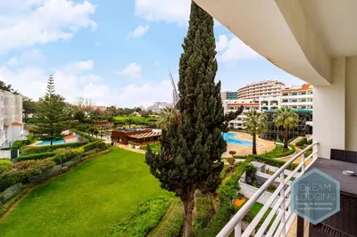 a view from the balcony of a resort with a pool at Albufeira Breeze Living - Dream Lodging in Albufeira