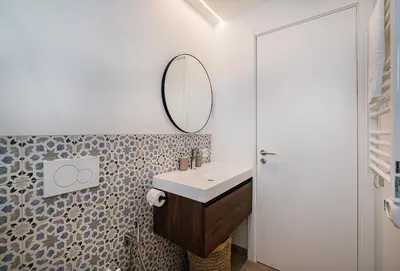 a bathroom with a sink and a mirror at Casa Joaninha - Heated pool - Algarve in Algoz