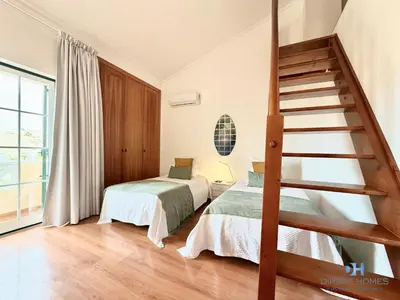 a bathroom with a toilet and a shower and a sink at Villa Rosal 21 in Albufeira