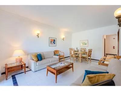 a living room with a couch and a table at Apartment Rita - Sunny Way by Interhome in Albufeira