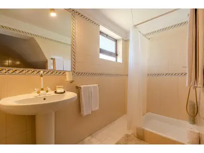 a bathroom with a toilet and a tub and a sink at Apartment Rita - Sunny Way by Interhome in Albufeira