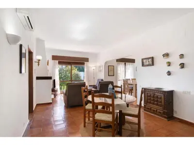 a kitchen and living room with a table and chairs at Holiday Home Casa Mila - Sunny Way by Interhome in Albufeira