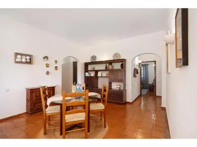 a kitchen and dining room with a table and chairs at Holiday Home Casa Mila - Sunny Way by Interhome in Albufeira