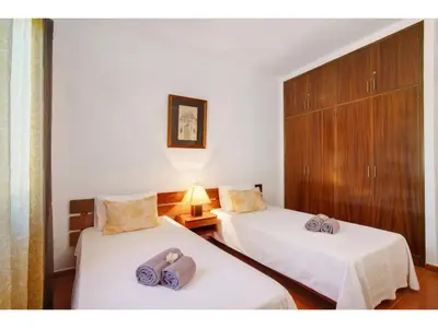 a room with two beds with towels on them at Holiday Home Casa Mila - Sunny Way by Interhome in Albufeira