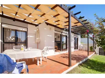 a patio with a white table and chairs at Holiday Home Casa Mila - Sunny Way by Interhome in Albufeira